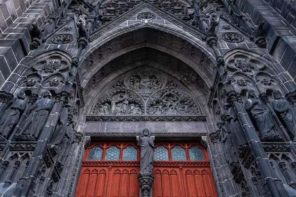 stock image Portal of the Notre-Dame-de-l'Assomption Cathedral in Clermont-Ferrand, France, built in black Volvic stone, in the French department of Puy-de-Dome, in the Auvergne Rhone-Alpes region
