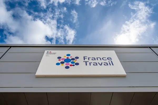 stock image Biarritz, France - May 30, 2024: Sign and logo at the entrance to a France Travail agency. France Travail, formerly Ple Emploi, is the French administration in charge of employment
