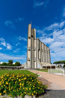 Royan, France - June 1, 2024: Exterior view of the Notre-Dame de Royan Catholic Church, built in concrete in 1955 to replace the old church destroyed by a bombing in 1945 clipart