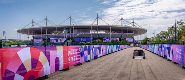 Saint-Denis, France - July 18, 2024: Distant view of Stade de France, the largest French stadium and an Olympic venue, decorated for the Paris 2024 Summer Olympics