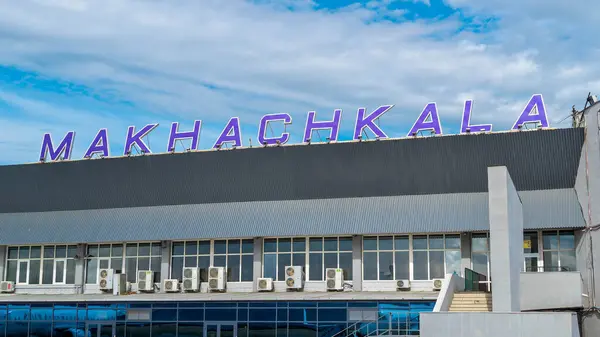 Stock image Makhachkala, Dagestan, Russian Federation - September 18, 2024: Sign on the roof of a passenger terminal of the Makhachkala Amet Khan Sultan International Airport