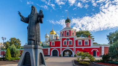 Moscow, Russian Federation - September 20, 2024: Monument to Saint Alexis Metropolitan of Moscow and entrance to the Zachatyevsky Stavropegic Monastery also known as the Conception Convent clipart