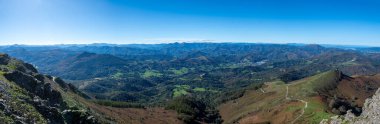 Panoramic view of the Pyrenees mountains in Navarre, in the Spanish Basque Country, from the peak of La Rhune also known by the Basque name of Larrun (901 m), located on the French-Spanish border clipart