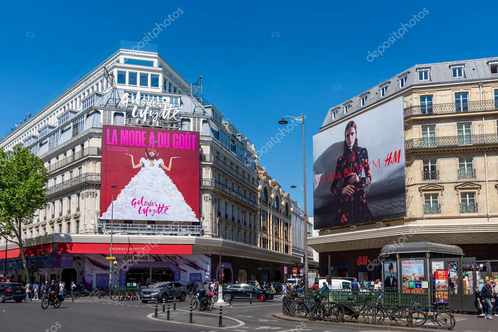 Paris, France - April 28, 2025: Advertising billboards for Galeries Lafayette and for Polish designer Magda Butrym fashion collection for H and M in a street of Paris, France