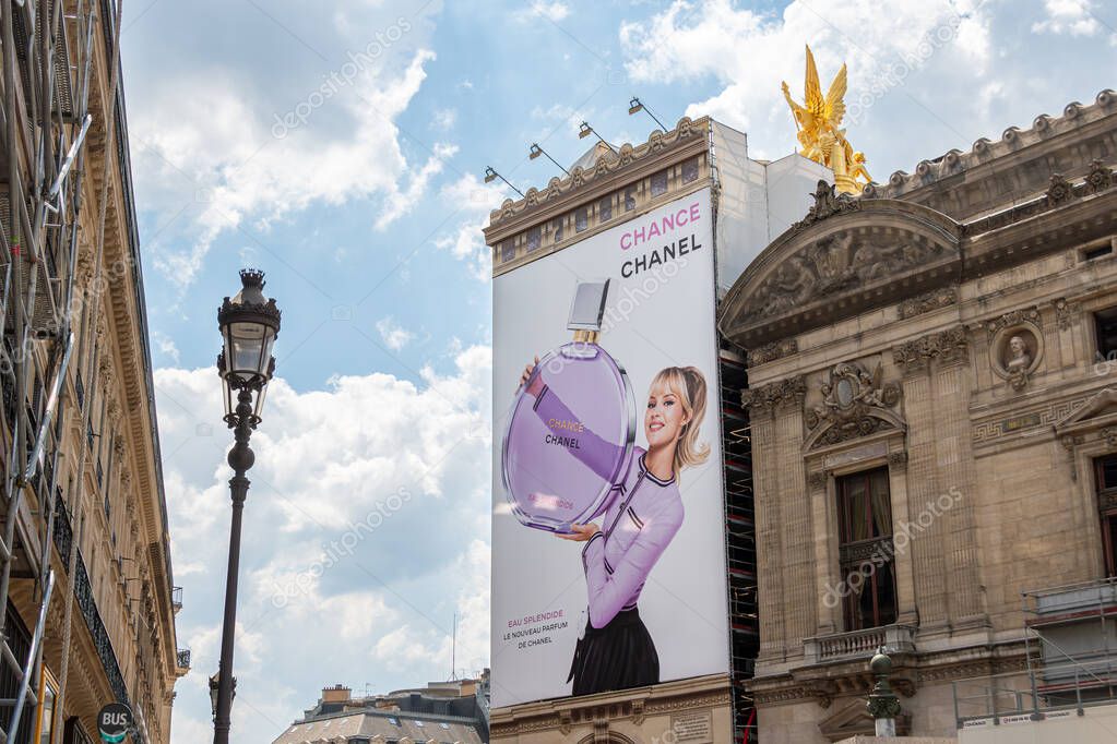 Large advertising billboard for Chance Eau Splendide fragrance by Chanel over the scaffoldings of the restoration works on the side facade of the Paris Opera house (Palais Garnier)