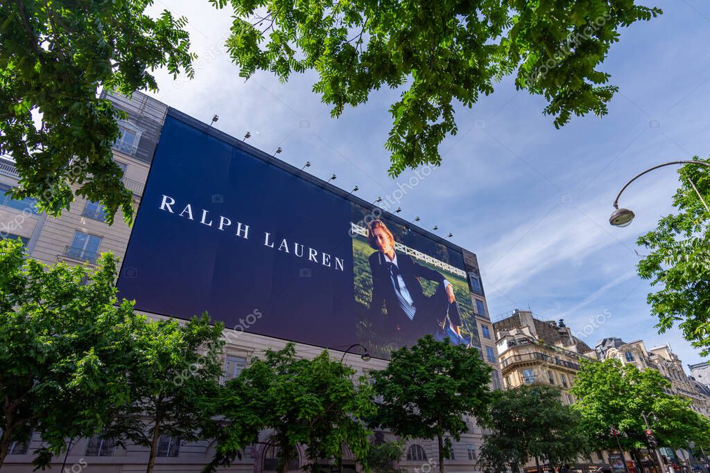 Paris, France - May 29, 2025: Large advertising billboard for Ralph Lauren, an American fashion brand, covering the scaffoldings of the restoration works on the facade of a parisian building
