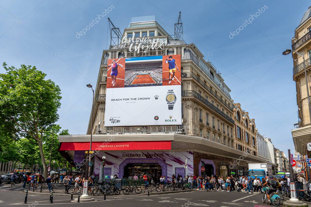 Paris, France - June 10, 2025: Advertising billboard for Rolex about the Roland Garros French open tennis tournament over the facade of the Galeries Lafayette, a famous Parisian department store
