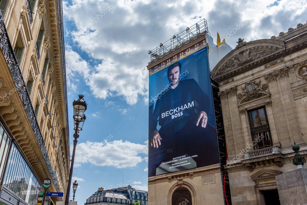 Paris, France - June 16, 2025: Advertising billboard for the Beckham - Boss collection, by Hugo Boss, over the restoration works on the side facade of the Paris Opera house (Palais Garnier)