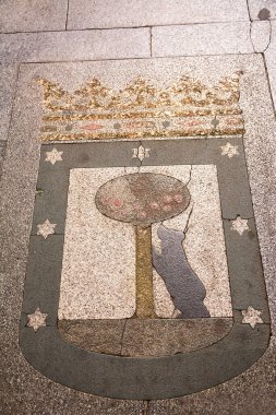 Madrid, Spain - June 20, 2022: The bear with the strawberry tree, symbol of Madrid, on the sidewalks