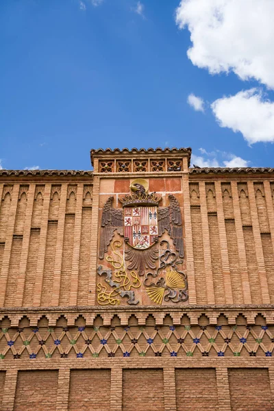 Coat of arms above the building of the art school in the Jewish quarter in Toledo (Spain)