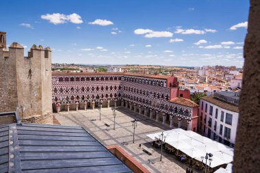 Badajoz, Spain - 24 June 2022: View from above facades of the colorful buildings and houses in the Alta Square in Badajoz (Spain) clipart