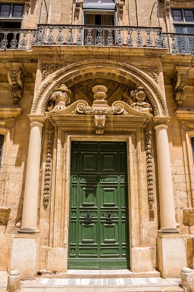 Door and balconies with worked structure in the center of Mdina (Malta)