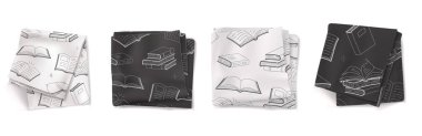 Siyah beyaz mutfak havluları, açık kitap desenli kumaş peçeteler. Katlanmış kare tekstil bulaşık bezleri, çay havluları beyaz arka planda izole edilmiş..
