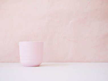 Coffee cup, tea mug and rose on table with pink background for lettering writing message for Mother's day ,Valentine's ,Greeting card ,Celebrate ,empty wall Copy space Romantic love festive card 