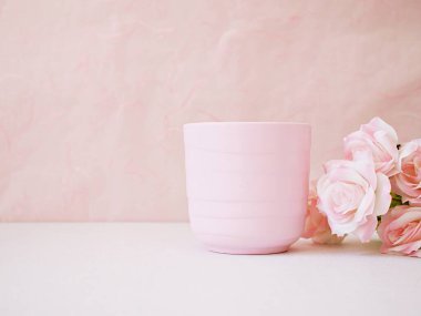 Coffee cup, tea mug and rose on table with pink background for lettering writing message for Mother's day ,Valentine's ,Greeting card ,Celebrate ,empty wall Copy space Romantic love festive card 