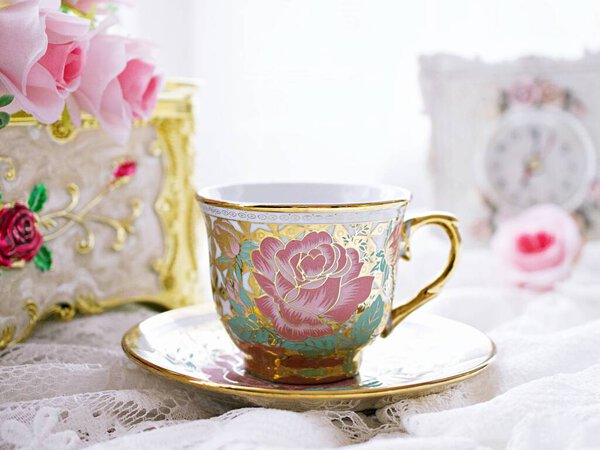 Antique cup of tea with pink rose on white background ,English tea vintage tone Valentine's day romantic ,Mother's day ,pretty background ,Chinese traditional ,coffee cup ,porcelain teacup 