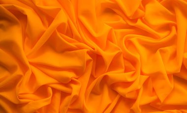 Orange cloth Background,Texture Pattern Yellow Color Fabric,Light on Silk,Luxury Banner Abstract Summer Design Card or Poster,Soft Smooth Wallpaper Fasion colorful Gradient Shape Mouck Up,Blur Soft.