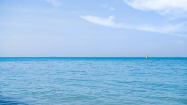 Sea Summer with Blue Sky Background,Blue Ocean with Cloud White Beautiful Seascap,Smooth Wave of Water Calm Nature,Shore Tropical at Coast,for Tourism Relax Vacation in Holidays,Landscape Wallpaper.