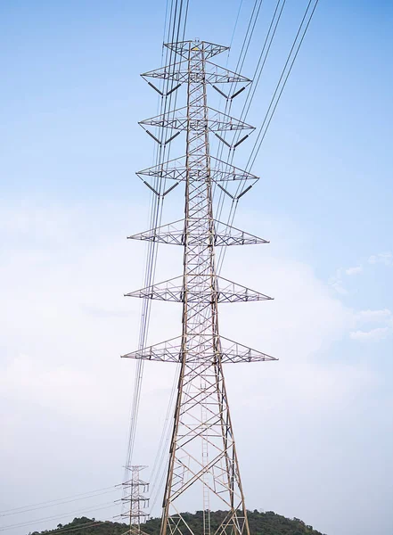 High Voltage Pole Power Utility Line Tower Electric Transmission Energy Station Distribution on Blue Sky Background, Technology Construction Architecture Electric Grid Substation Success Communication