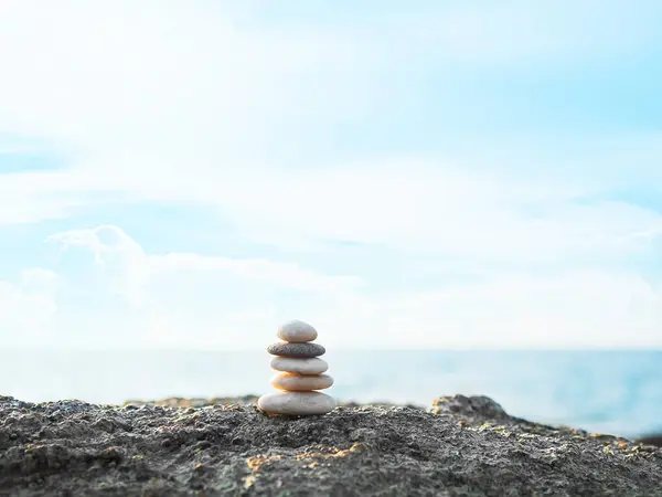 Stone Stack Zen Balance on Calm Water Background Sea Spa Stability Concept Template Relax Massage Harmony Peace, Pile Pebble at Coast Ocean Nature Landscape Outdoor.