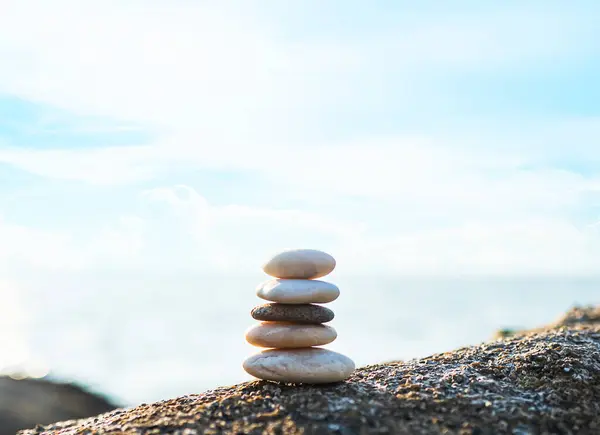 Stone Stack Zen Balance on Calm Water Background Sea Spa Stability Concept Template Relax Massage Harmony Peace, Pile Pebble at Coast Ocean Nature Landscape Outdoor.