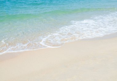 Travel Nature Concept, Sea Sand Background Blue Water at Coast Season Summer Tropical Ocean Beautiful Wave Seascape Vacation Smooth Wallpaper Island Outdoor Tropical Coast Sandy Nature Landscape.