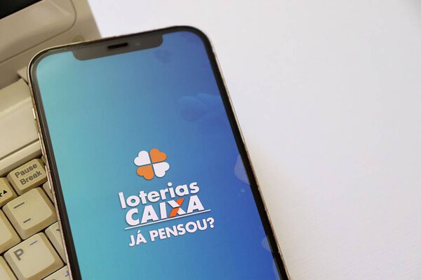 Bahia, Brazil, July 21st, 2025: Loterias Caixa app on smartphone screen. Lottery tickets. Brazilian lottery concept (Caixa Economica). 