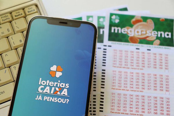 Bahia, Brazil, July 21st, 2025: Loterias Caixa app on smartphone screen. Lottery tickets. Brazilian lottery concept (Caixa Economica). 