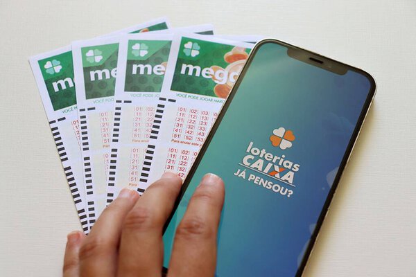 Bahia, Brazil, July 21st, 2025: Loterias Caixa app on smartphone screen. Lottery tickets. Brazilian lottery concept (Caixa Economica). 