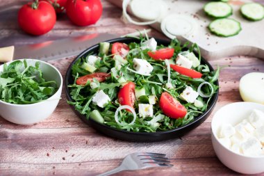 Slices of bread with red caviar on a plate, on a white background.