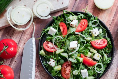 Slices of bread with red caviar on a plate, on a white background.