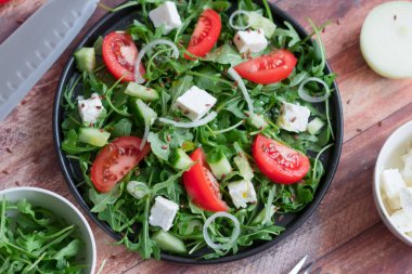 Slices of bread with red caviar on a plate, on a white background.