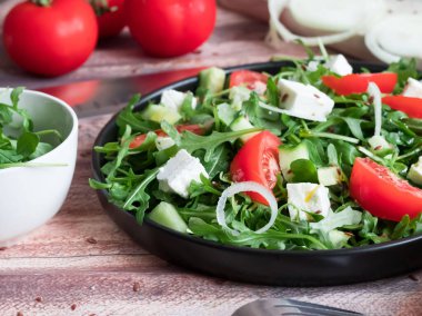 Slices of bread with red caviar on a plate, on a white background.