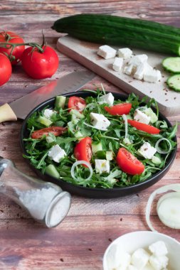 Slices of bread with red caviar on a plate, on a white background.