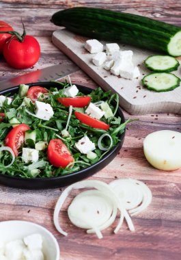 Slices of bread with red caviar on a plate, on a white background.