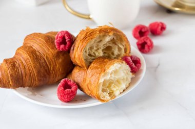 Morning with a cup of coffee and croissants. On a white background. Breakfast.
