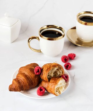 Morning with a cup of coffee and croissants. On a white background. Breakfast.