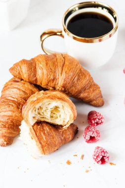 Morning with a cup of coffee and croissants. On a white background. Breakfast.