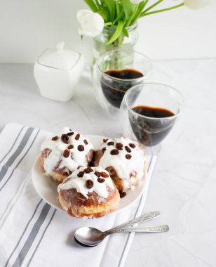 Donuts and black coffee on a white background. breakfast