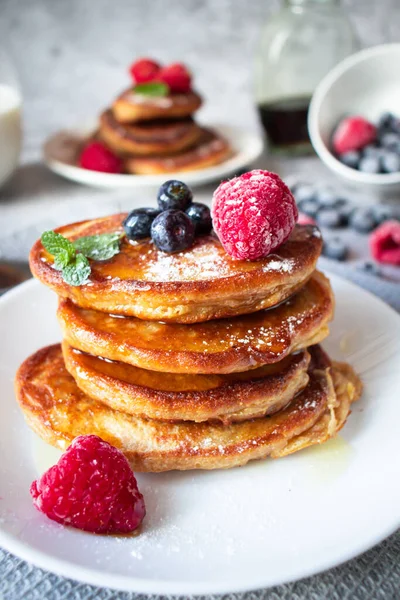 stock image Pancakes with berries. breakfast. On a concrete background