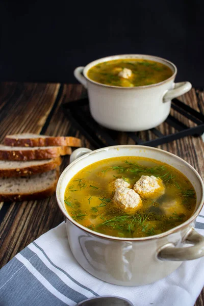 stock image Soup close-up. Soup with meatballs. On a wooden background.