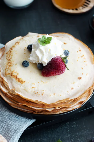 stock image Fresh pancakes with berries. Breakfast. On a dark background