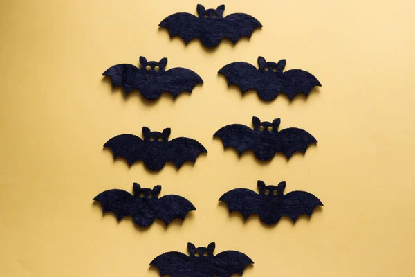 Black Paper Bats Yellow Background — Stock Photo, Image