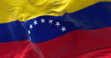 Venezuela ulusal bayrağının rüzgarda dalgalanırken yakın çekim görüntüsü. Bolivarya 'nın Venezuela Cumhuriyeti, Kuzey Amerika' da bulunan bir devlettir. Kumaş desenli arka plan. Seçici odak
