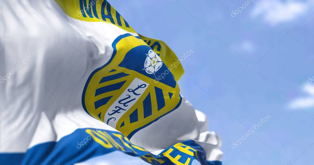 Leeds, UK, Oct. 2022: The Leeds United flag waving in the wind. Leeds United Football Club is an English football club based in Leeds. 3D illustration render. Selective focus