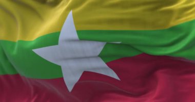 Myanmar 'ın ulusal bayrağının dalgalanmasına yakından bakın. Myanmar Cumhuriyeti, Güneydoğu Asya devletinde bir şehirdir. Kumaş desenli arka plan. Seçici odaklanma. Yavaş çekimde kusursuz döngü. 3 Boyutlu Hazırlama