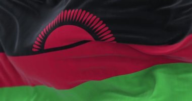 Malawi Ulusal bayrağının dalgalanma görüntüsü. Malawi Cumhuriyeti, Afrika kıtasında bulunan bir ülkedir. Kumaş desenli arka plan. Seçici odaklanma. Yavaş çekimde kusursuz döngü. 3 Boyutlu Hazırlama