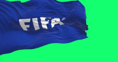 Zürih, CH, Ekim 2022: Yeşil arka planda izole edilmiş Fifa bayrağının yakın çekim görüntüsü. Fifa, Amerikan futbolunun uluslararası yönetim organıdır. Yavaş çekimde kusursuz döngü. 3 Boyutlu Hazırlama