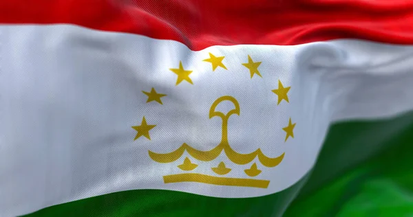 風になびくタジキスタン国旗のクローズアップ タジキスタン共和国は中央アジアの内陸国である 生地の質感の背景 選択的フォーカス 3Dイラスト — ストック写真