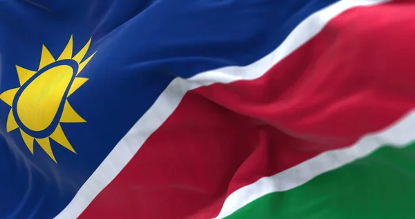 ナミビア国旗が手を振っている様子を間近で見ることができる ナミビア共和国は南アフリカの国です 生地の質感の背景 選択的フォーカス 3Dイラスト — ストック写真